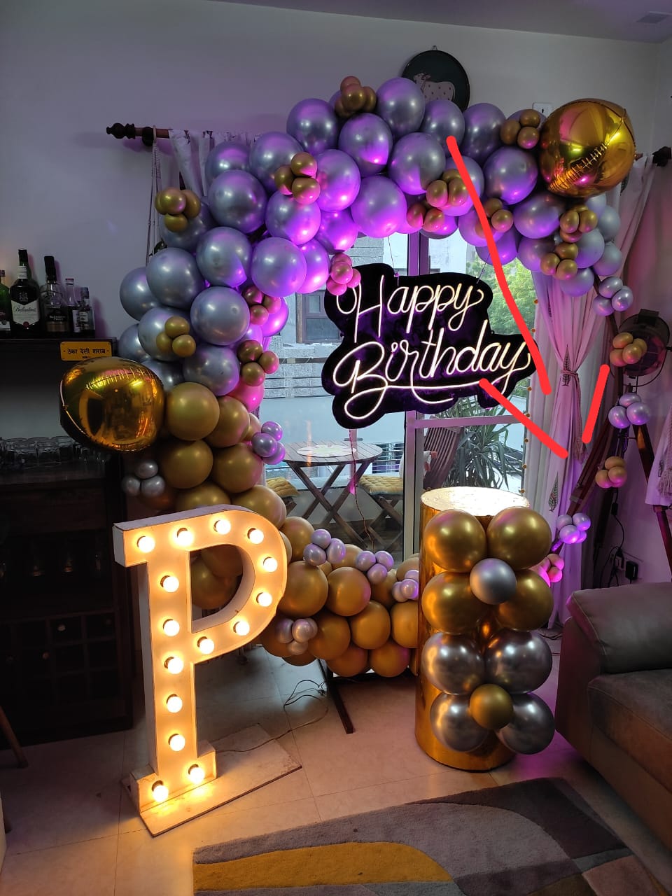 ring arch with chrome balloon decor